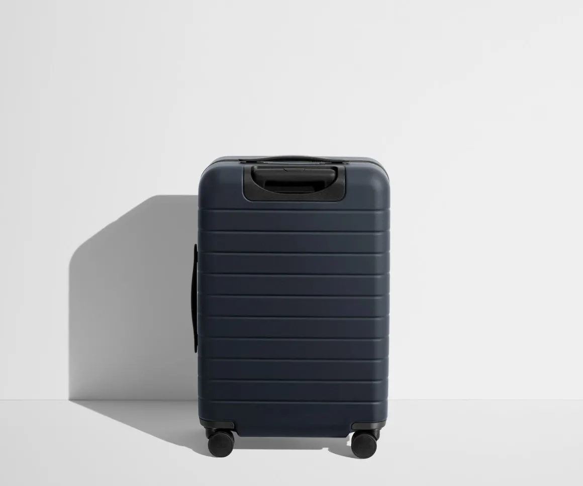 The Bigger Carry-On Flex in Navy Blue